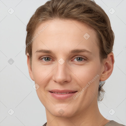 Joyful white young-adult female with short  brown hair and grey eyes