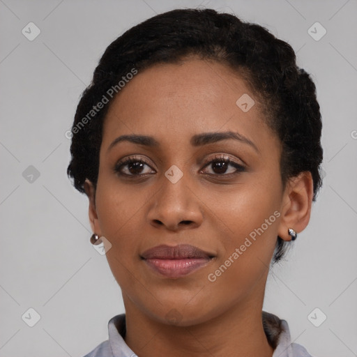 Joyful black young-adult female with short  black hair and brown eyes