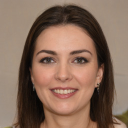 Joyful white young-adult female with medium  brown hair and brown eyes