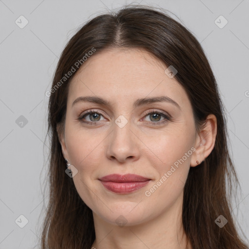 Joyful white young-adult female with long  brown hair and grey eyes