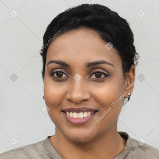 Joyful latino young-adult female with short  black hair and brown eyes