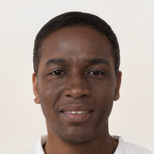 Joyful black young-adult male with short  brown hair and brown eyes