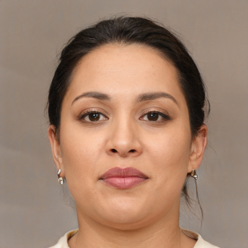 Joyful white young-adult female with medium  brown hair and brown eyes