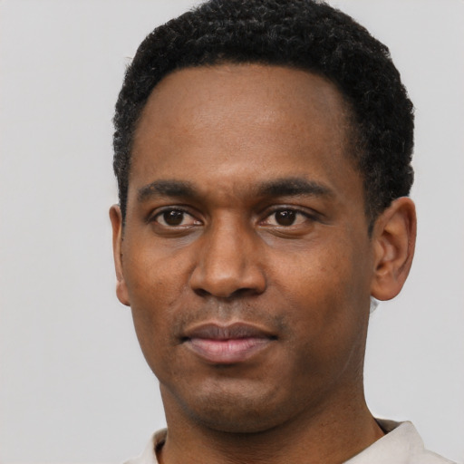 Neutral black young-adult male with short  black hair and brown eyes
