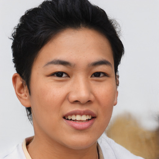 Joyful asian young-adult female with short  brown hair and brown eyes