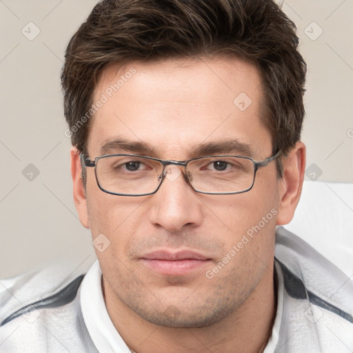 Joyful white adult male with short  brown hair and brown eyes