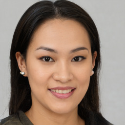 Joyful asian young-adult female with medium  brown hair and brown eyes