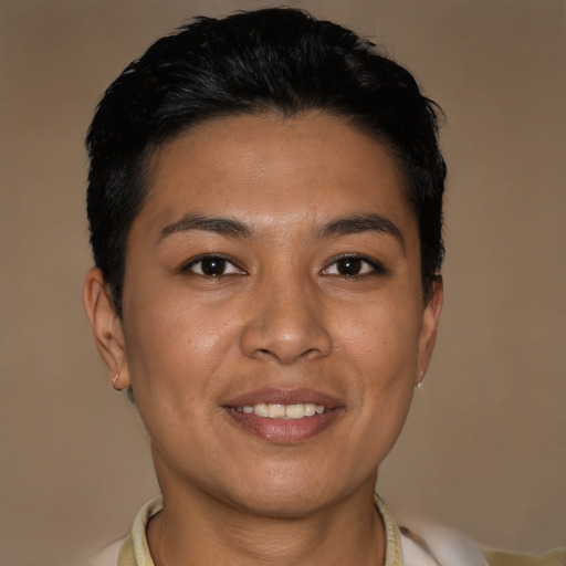 Joyful latino young-adult female with short  black hair and brown eyes