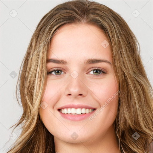 Joyful white young-adult female with long  brown hair and green eyes