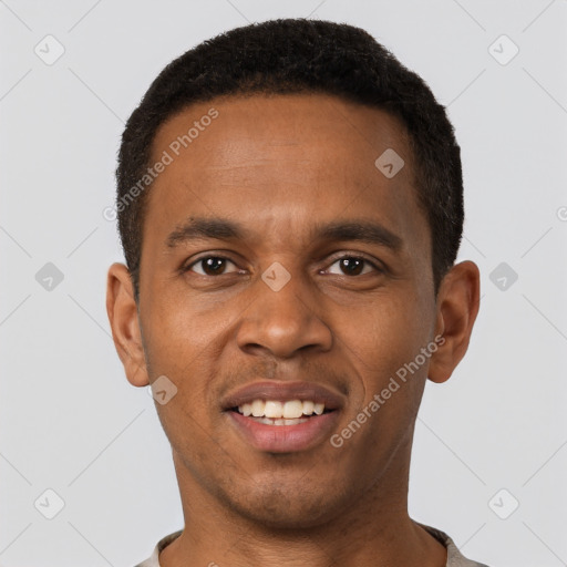 Joyful black young-adult male with short  brown hair and brown eyes