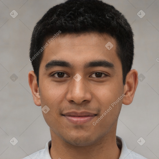 Joyful latino young-adult male with short  black hair and brown eyes