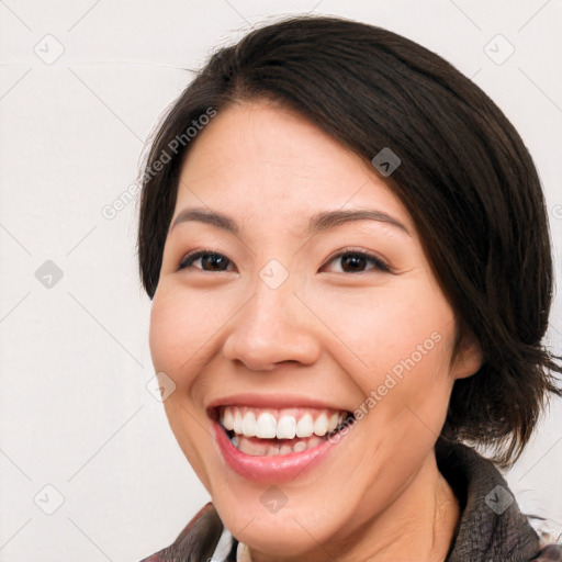 Joyful white young-adult female with medium  brown hair and brown eyes