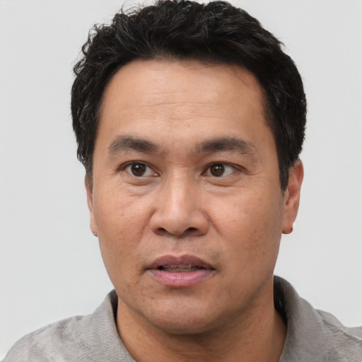 Neutral white adult male with short  black hair and brown eyes