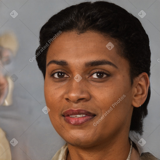 Joyful black young-adult female with medium  brown hair and brown eyes