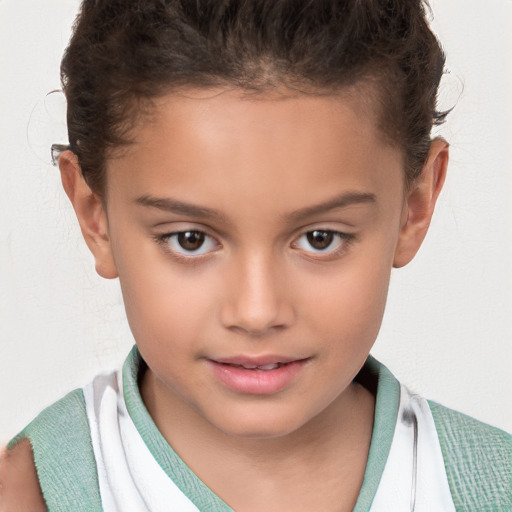 Joyful white child female with short  brown hair and brown eyes