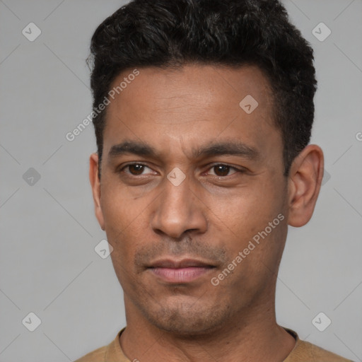 Neutral latino young-adult male with short  black hair and brown eyes