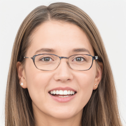 Joyful white young-adult female with long  brown hair and grey eyes