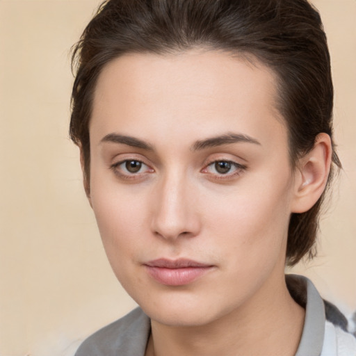 Neutral white young-adult female with medium  brown hair and brown eyes