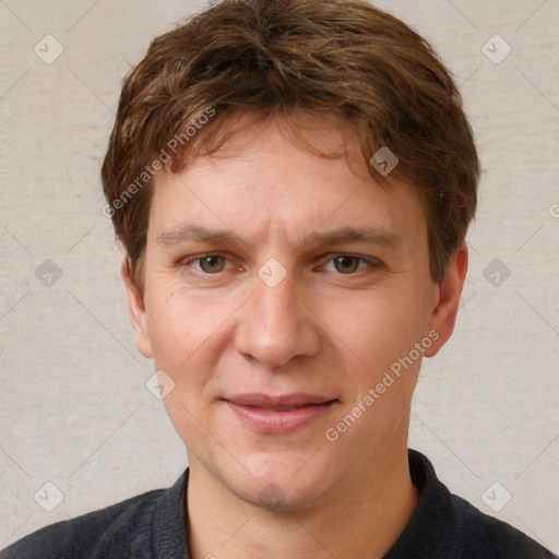 Joyful white adult male with short  brown hair and grey eyes