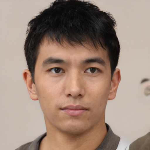 Neutral asian young-adult male with short  brown hair and brown eyes