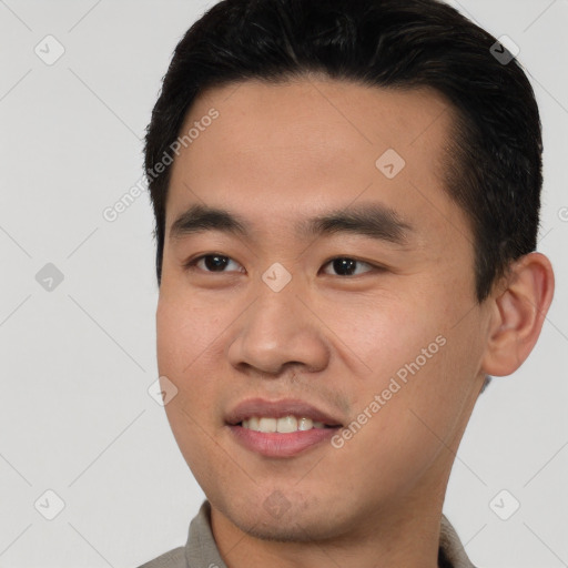 Joyful white young-adult male with short  black hair and brown eyes