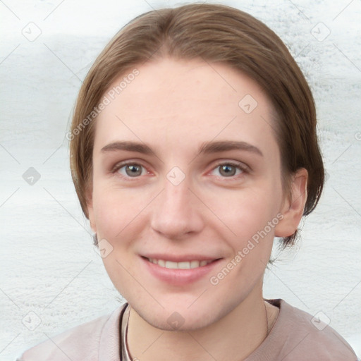 Joyful white young-adult female with short  brown hair and blue eyes