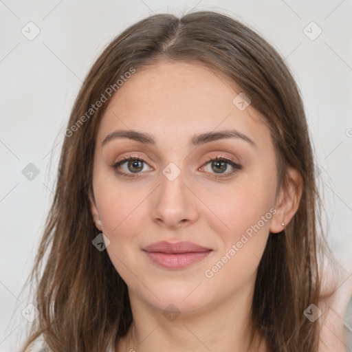 Joyful white young-adult female with long  brown hair and grey eyes