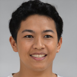 Joyful latino young-adult male with short  brown hair and brown eyes