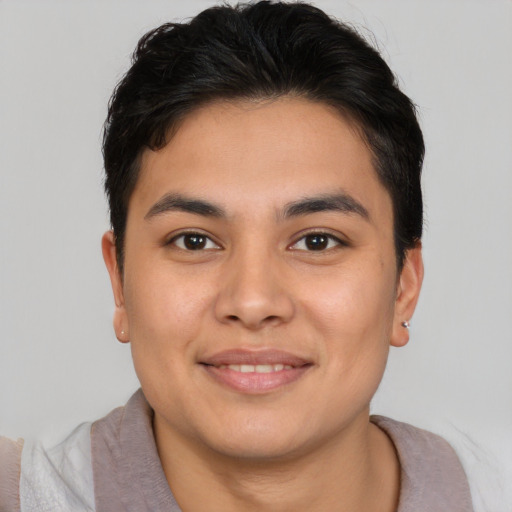 Joyful asian young-adult male with short  brown hair and brown eyes