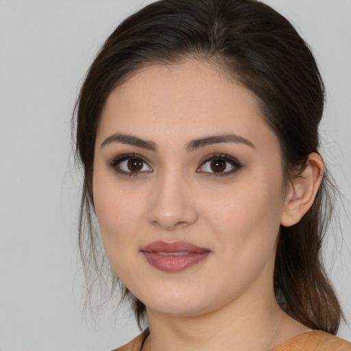 Joyful white young-adult female with medium  brown hair and brown eyes