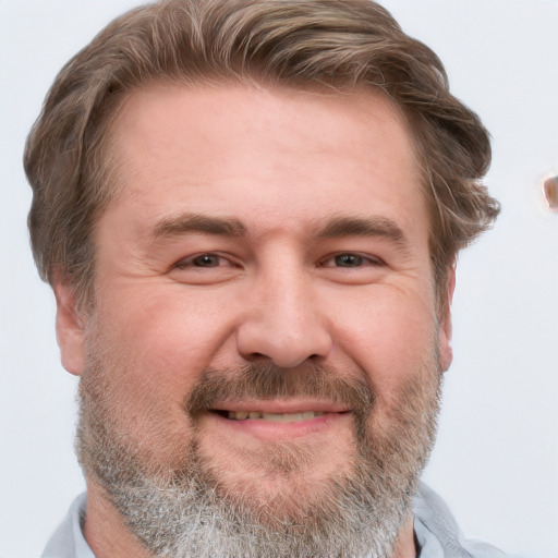 Joyful white adult male with short  brown hair and grey eyes