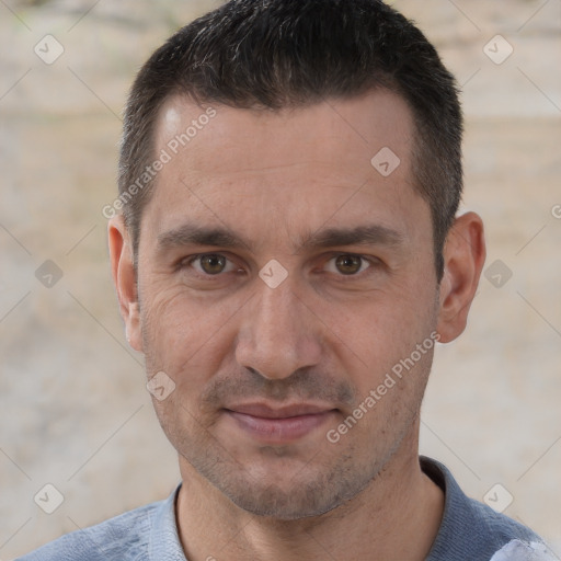 Joyful white adult male with short  brown hair and brown eyes