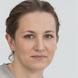 Joyful white adult female with short  brown hair and grey eyes