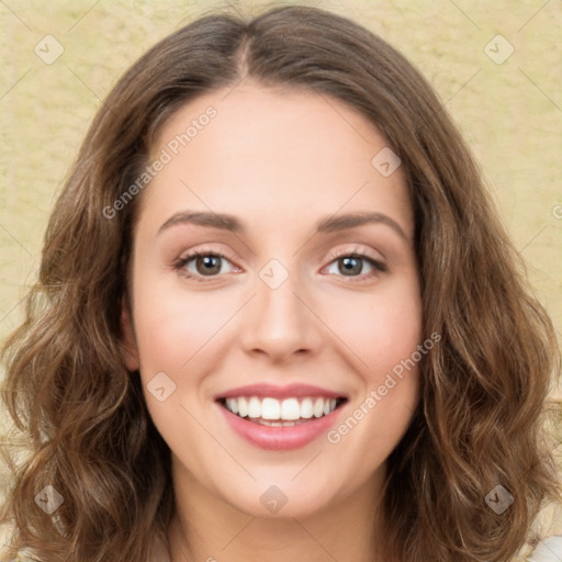 Joyful white young-adult female with long  brown hair and green eyes