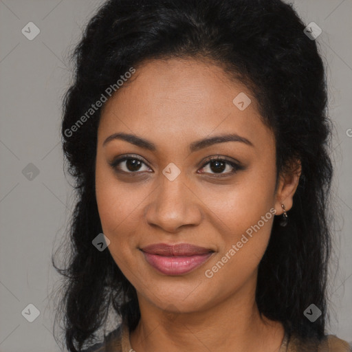 Joyful black young-adult female with long  brown hair and brown eyes