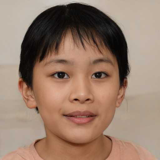 Joyful asian child female with short  brown hair and brown eyes