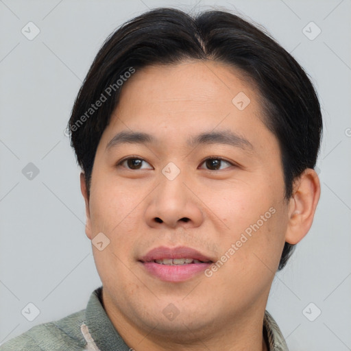 Joyful asian young-adult male with short  brown hair and brown eyes