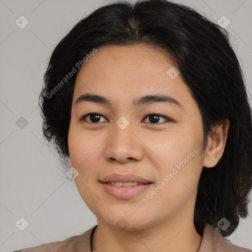 Joyful latino young-adult female with medium  black hair and brown eyes