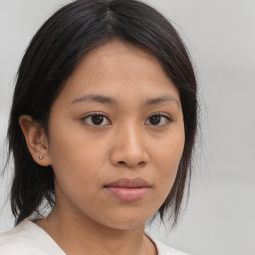 Neutral latino young-adult female with medium  brown hair and brown eyes