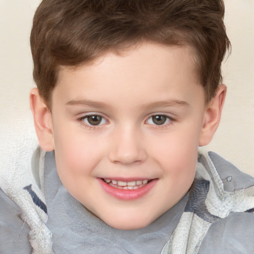 Joyful white child male with short  brown hair and brown eyes