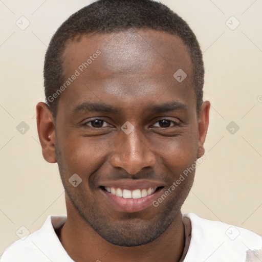 Joyful black young-adult male with short  brown hair and brown eyes