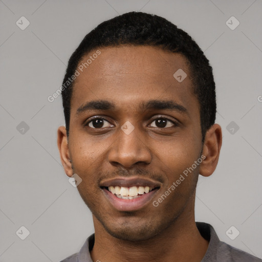 Joyful black young-adult male with short  black hair and brown eyes