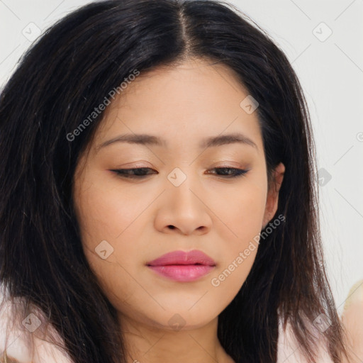 Joyful asian young-adult female with long  brown hair and brown eyes