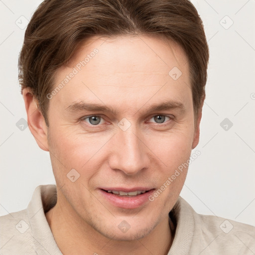 Joyful white young-adult male with short  brown hair and grey eyes