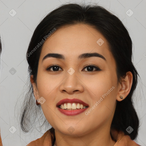 Joyful latino young-adult female with medium  black hair and brown eyes