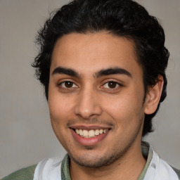 Joyful latino young-adult male with short  brown hair and brown eyes