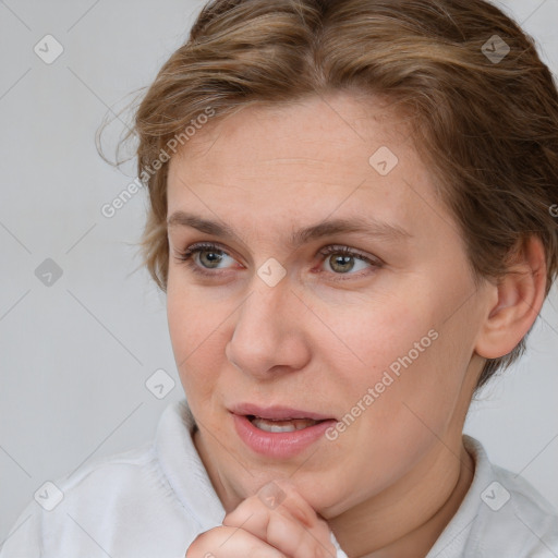 Joyful white adult female with short  brown hair and brown eyes