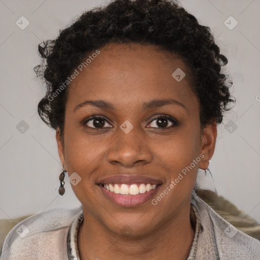 Joyful black young-adult female with short  brown hair and brown eyes