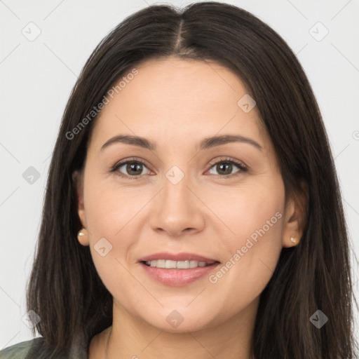 Joyful white young-adult female with long  brown hair and brown eyes