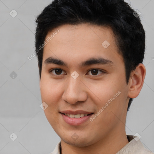 Joyful asian young-adult male with short  brown hair and brown eyes